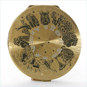 compact decorated with the signs of the zodiac