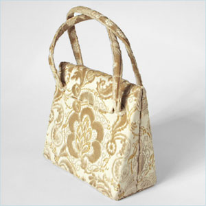 Ecru and gold tapestry handbag by Nettie Rosenstein