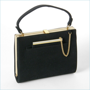 black suede handbag with an outer pocket