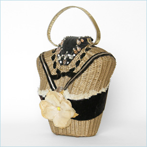 wicker handbag shaped like the upper torso of a woman