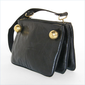 .Unique shoulder bag with three zippered, black leather pouches