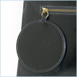 Minimalist, black leather clutch with flap closure