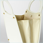 Chic, white lucite bag with industrial looking brass