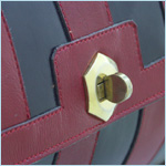 barrel-shaped leather handbag by Rosenfeld